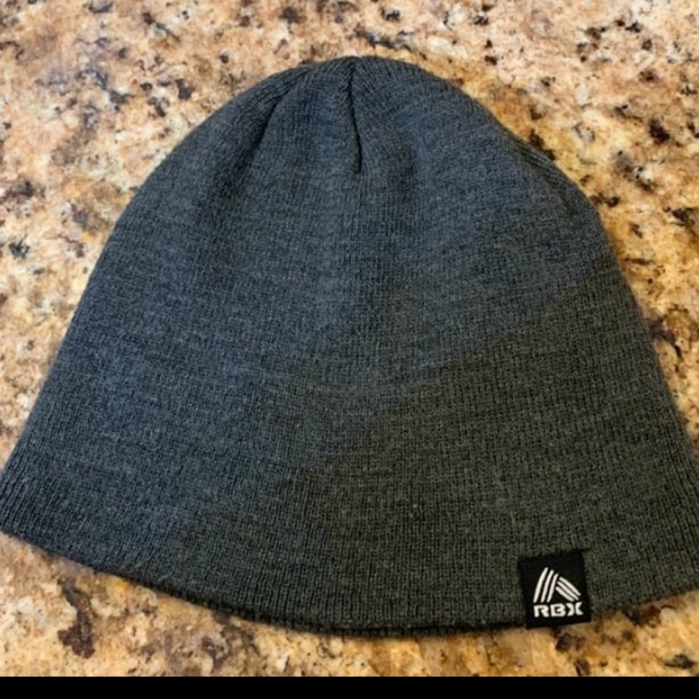 “RBX” Dark Gray Unisex Beanie. One Size Fits Most. Material: 100% Acrylic.